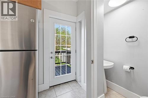 Kitchen overlooks backyard with w/o to the back deck - 343 Cumberland Avenue, Hamilton, ON 
