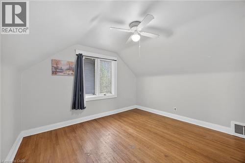 Hardwood flooring throughout this room with sloped ceilings - 43 West 1St Street, Hamilton, ON 