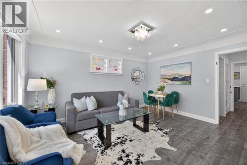 Open-concept living space with recessed lighting and crown molding - 43 West 1St Street, Hamilton, ON 