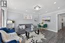 Open-concept living space with recessed lighting and crown molding - 43 West 1St Street, Hamilton, ON 