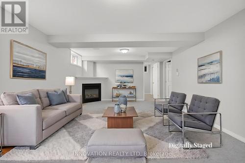 Virtually staged - 407 Flora Street, Carleton Place, ON - Indoor Photo Showing Living Room With Fireplace