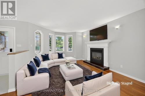 Virtually staged - 407 Flora Street, Carleton Place, ON - Indoor Photo Showing Living Room With Fireplace