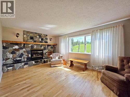 4667 Lund Road, Quesnel, BC - Indoor Photo Showing Living Room With Fireplace