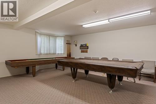 Enjoy a game of pool located Rec room, which also has a kitchen. - 1534 Lawrence Avenue Unit# 304, Kelowna, BC - Indoor Photo Showing Other Room