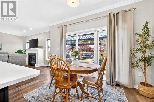 58 Postma Drive, Haldimand, ON - Indoor Photo Showing Dining Room With Fireplace