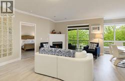 Living room to primary bedroom and dining area (digitally altered photos – leaves added) - 