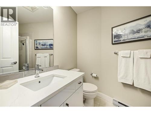 Main bathroom with quartz counters - 1960 Enterprise Way Unit# 412, Kelowna, BC - Indoor Photo Showing Bathroom
