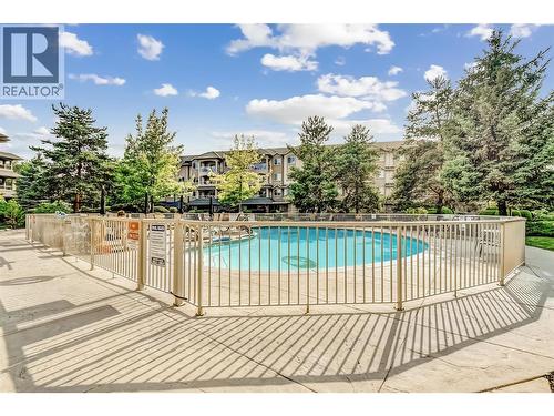 Outdoor heated pool - 1960 Enterprise Way Unit# 412, Kelowna, BC - Outdoor With In Ground Pool