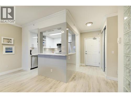 Entrance and updated kitchen - 1960 Enterprise Way Unit# 412, Kelowna, BC - Indoor Photo Showing Kitchen