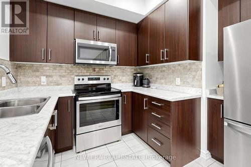 216 - 3865 Major Mackenzie Drive W, Vaughan, ON - Indoor Photo Showing Kitchen With Double Sink With Upgraded Kitchen