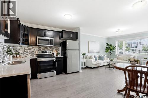 409 225 Hassard Close, Saskatoon, SK - Indoor Photo Showing Kitchen With Stainless Steel Kitchen With Double Sink