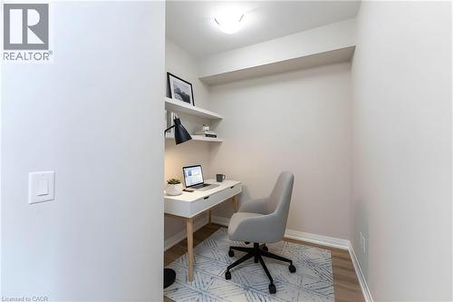 Office featuring baseboards and light wood-style flooring - 120 Springvalley Crescent Unit# 104, Hamilton, ON 