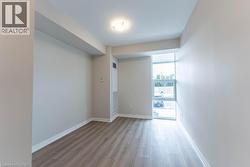Unfurnished room featuring baseboards and light wood-type flooring - 