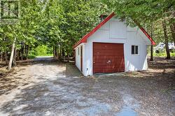 Detached garage with concrete floors and a loft - 