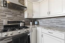 Stainless steel gas range with a coordinating range hood - 
