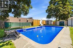 In-ground swimming pool with a concrete surround - 