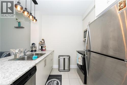 16 Concord Place Unit# 209, Grimsby, ON - Indoor Photo Showing Kitchen With Double Sink