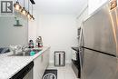 16 Concord Place Unit# 209, Grimsby, ON  - Indoor Photo Showing Kitchen With Double Sink 