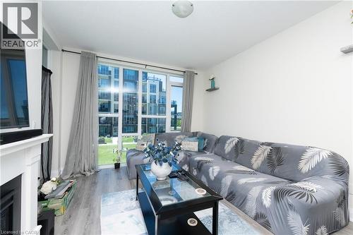 16 Concord Place Unit# 209, Grimsby, ON - Indoor Photo Showing Living Room With Fireplace
