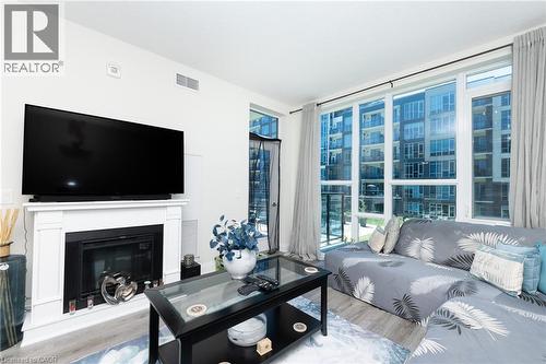 16 Concord Place Unit# 209, Grimsby, ON - Indoor Photo Showing Living Room With Fireplace