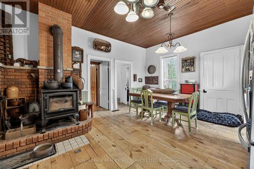 1351 Flos Rd 11 E, Springwater, ON - Indoor Photo Showing Dining Room With Fireplace