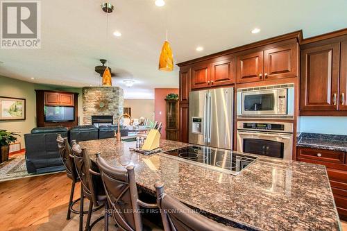 7 Nevis Ridge Drive, Oro-Medonte, ON - Indoor Photo Showing Kitchen With Fireplace With Stainless Steel Kitchen With Double Sink With Upgraded Kitchen