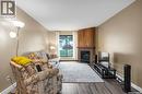 612 310 Stillwater Drive, Saskatoon, SK  - Indoor Photo Showing Living Room With Fireplace 