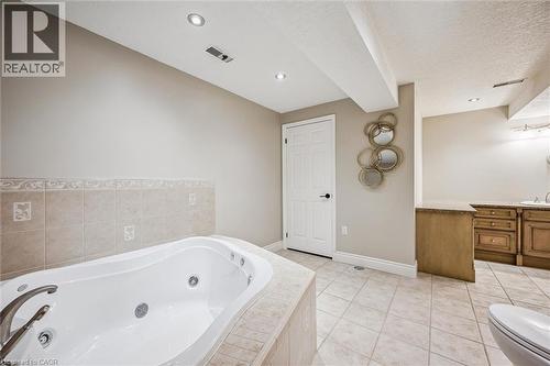 Jetted soaking tub - 44 Mcnichol Drive, Cambridge, ON - Indoor Photo Showing Bathroom