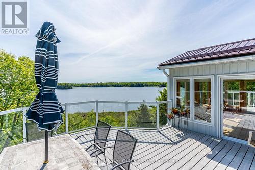 1123 Balmoral Lane, Highlands East (Glamorgan), ON - Outdoor With Body Of Water With Deck Patio Veranda