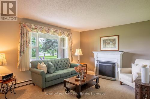 383 Old Surrey Lane, Kawartha Lakes (Bobcaygeon), ON - Indoor Photo Showing Living Room With Fireplace
