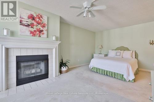 4 - 2407 Woodward Avenue, Burlington (Brant), ON - Indoor Photo Showing Bedroom With Fireplace