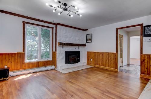 Salle à manger - 92  - 94 Crois. Desautels, Saint-Charles-Sur-Richelieu, QC - Indoor Photo Showing Living Room With Fireplace