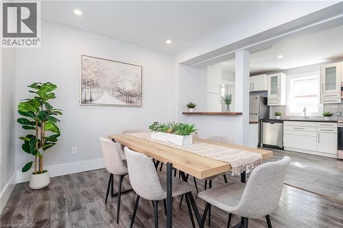 Dining area featuring wood-finish flooring and recessed lighting - 40 Woodland Avenue, Kitchener, ON 