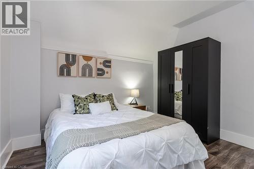 Room featuring wood-finish flooring and light-toned walls - 40 Woodland Avenue, Kitchener, ON 