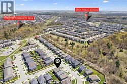 Aerial perspective showcasing a residential neighborhood with tree-lined streets - 