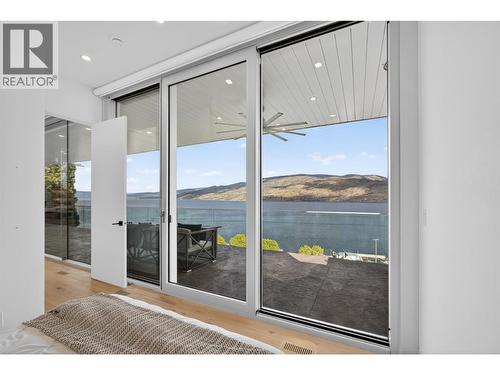 From this angle, you can really appreciate the benefit of the Outdoor Kitchen being cantilevered off the side of the house to not lose sight lines from what would likely be your office. - 5835 Vicary Road, Peachland, BC 