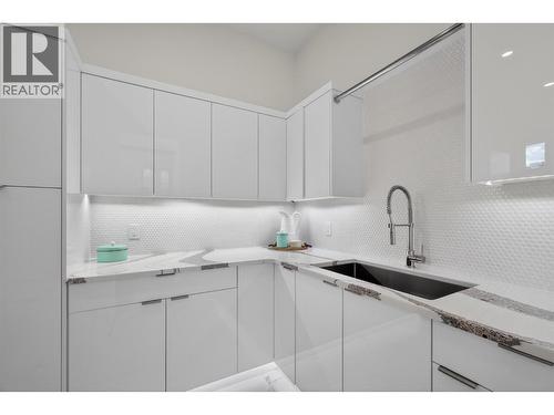 Large laundry area on the main with endless storage - 5835 Vicary Road, Peachland, BC 