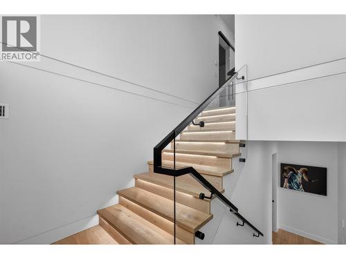 Back-lit treads and front-mounted glass railing with aluminum rail - 5835 Vicary Road, Peachland, BC 