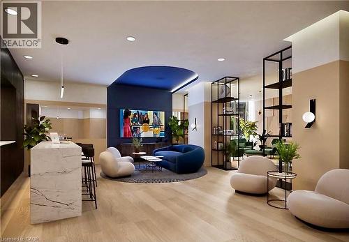 Contemporary communal area featuring light wood-finish flooring - 4878 Powers Common Unit# C-1105, Burlington, ON 