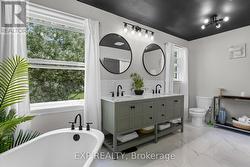 Freestanding Tub Overlooking Backyard - 