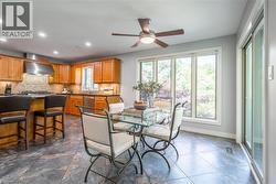 Dining area with baseboards, recessed lighting, and a ceiling fan - 