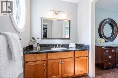 Bathroom with wood finished floors and vanity - 18 Westie Road, Brantford, ON 