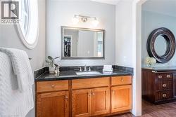 Bathroom with wood finished floors and vanity - 