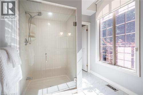 Bathroom featuring marble finish floor, a shower stall, baseboards, and visible vents - 18 Westie Road, Brantford, ON 