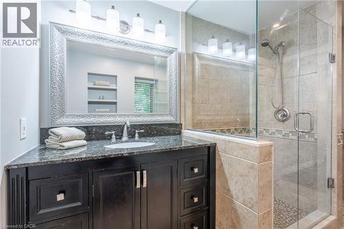 Full bathroom with vanity and a stall shower - 18 Westie Road, Brantford, ON 