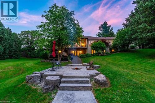 View of yard with stairs, an outdoor fire pit, and a patio area - 18 Westie Road, Brantford, ON 