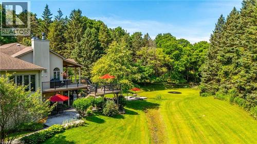 View of yard featuring a deck - 18 Westie Road, Brantford, ON 
