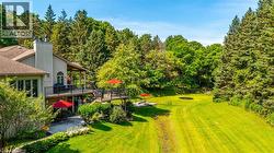 View of yard featuring a deck - 