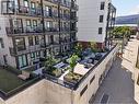 Offering a community patio with BBQs, tables & a dog run - 620 Coronation Avenue Unit# 211, Kelowna, BC 
