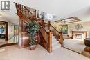 Grand staircase with rich wood paneling and balusters - 7775 St. Augustine Crescent, Niagara Falls, ON 